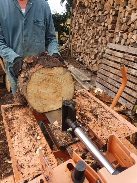 istock Splitting logs ready for log burner during colder winter months 1415022517