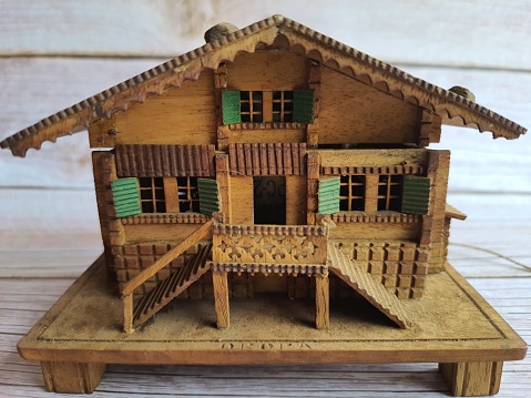 Small wooden house, handmade, with many details, front view, isolated.