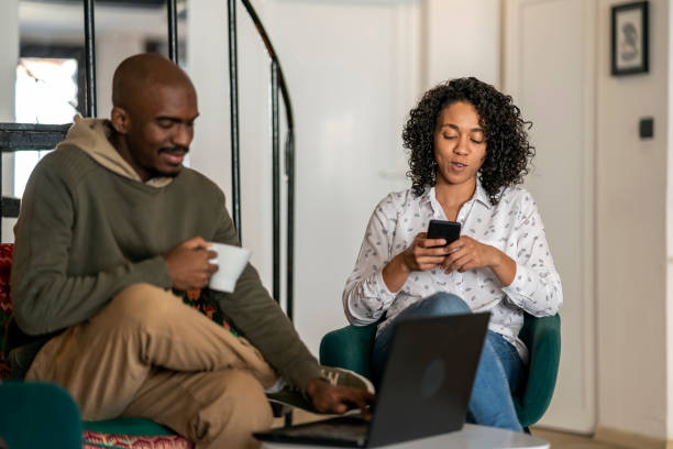 istock African American couple at home using the internet and talking. 1415026966