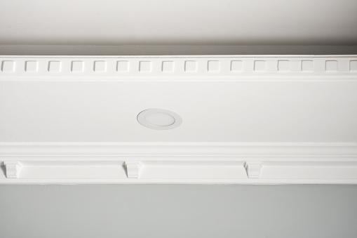 Stucco ceiling and wall. Molding, cornice. Old plaster architectural elements of the interior