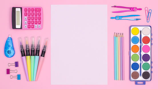 Back to school background with paper card copy space and school stationery on pastel pink theme. Flat lay