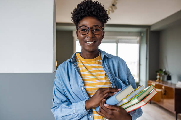 istock Portrait of a student holding books 1415028948