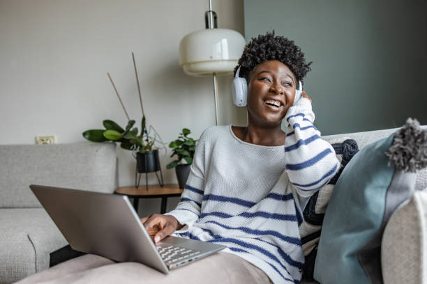 istock Young woman using laptop and relaxing 1415029800