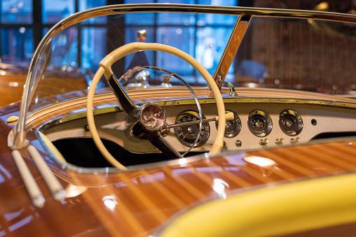 Classic vintage speedboat dashboard and steering wheel