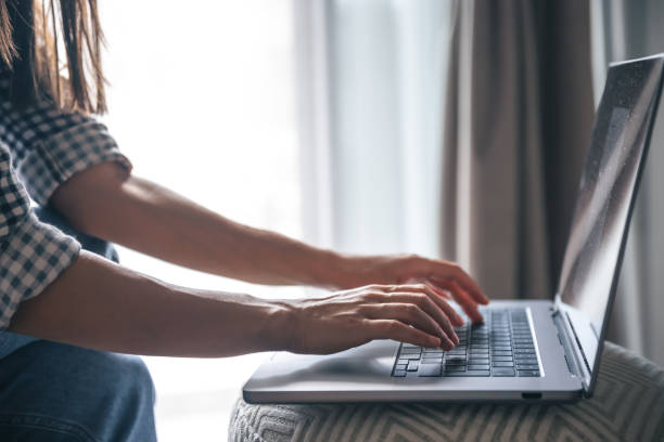 istock Close-up, female hands are working on a laptop. 1415035580