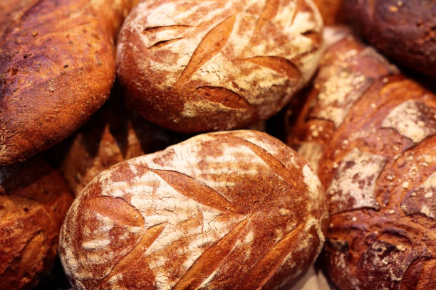 istock freshly baked traditional bread loaves in a bakery 1415035941