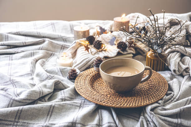 istock Cozy autumn composition with a big cup of coffee in bed. 1415037968