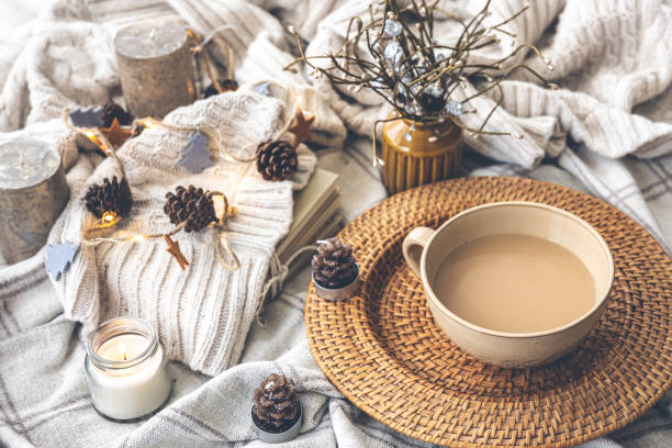 istock Cozy autumn composition with a big cup of coffee in bed. 1415037974