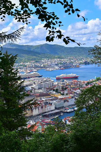 Bergen, Norway - July 2, 2022: view over Bergen city and harbour with cruise ships and pleasure boats, aerial view from Mount Floyen