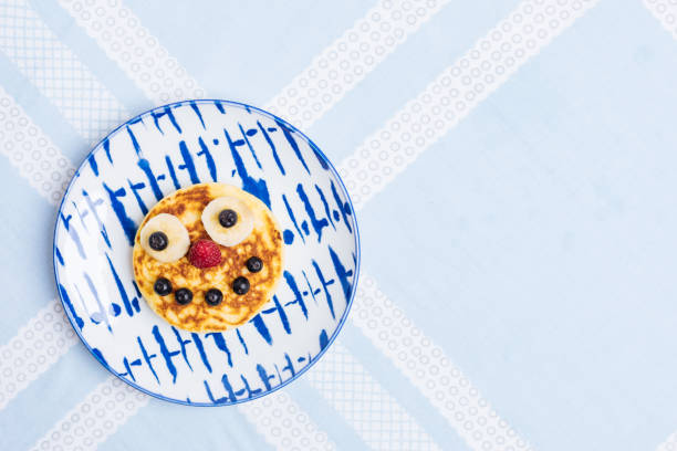 istock American Pancakes for Kids on blue background 1415044703