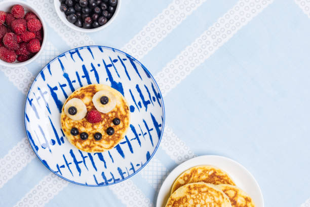 istock American Pancakes for Kids on blue background 1415044706