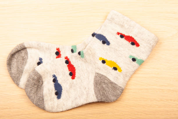 istock image of socks wooden desk background 1415046221