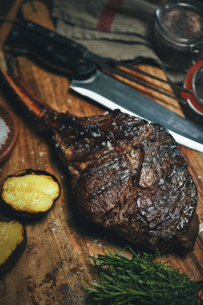 istock Grilled Tomahawk Steak with Potatoes 1415047153