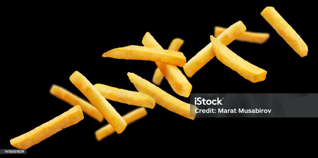 Delicious potato fries on black Delicious potato fries, isolated on black background Appetizer Stock Photo