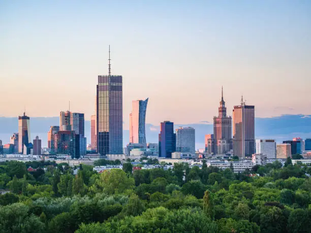 Photo of Warsaw city center and Pola Mokotowskie park at dusk aerial view