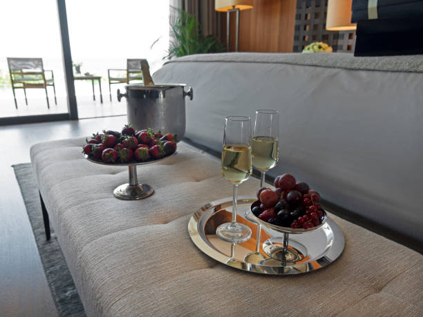 istock Champagne with Tropical summer fruits 1415052332