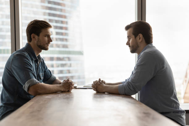 istock Two businessmen competing for leadership, meeting in office 1415053175