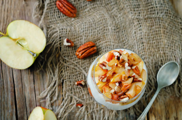 istock Caramelized apple pecan greek yogurt parfait in a glass 1415055151