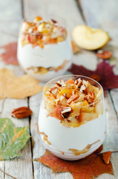 istock Caramelized apple pecan greek yogurt parfait in a glass 1415055156