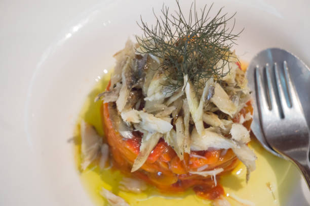 istock Escalibada salad Red peppers  with salad cod fish and olive oil 1415055358
