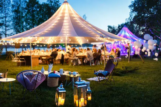 Colorful wedding tents at night. Wedding day.