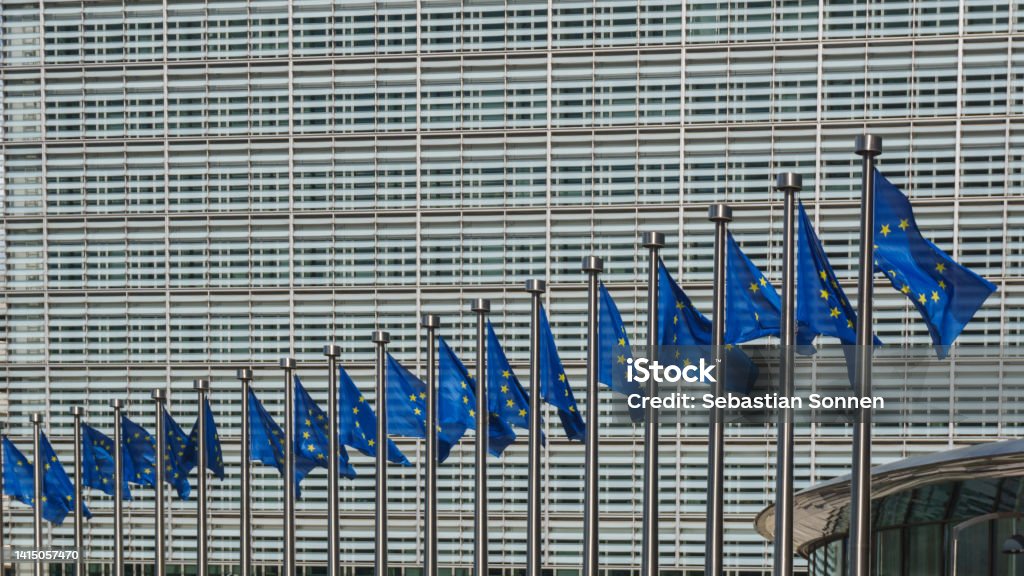 Row of EU Flags in front of the European Union Commission building in Brussels, Belgium Berlaymont Stock Photo