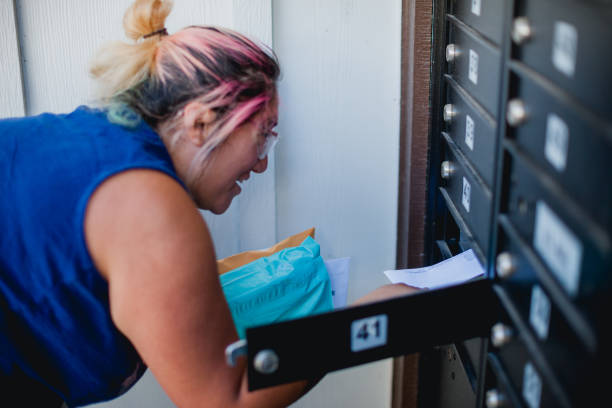 istock Woman Receiving Medicine by Mail 1415058570