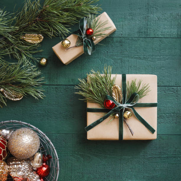 istock Christmas presents, green wood background 1415058700