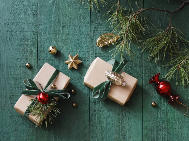 istock Christmas presents, green wood background 1415058729
