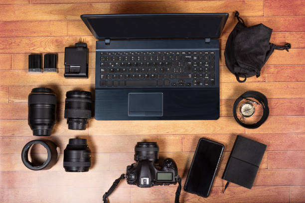 istock IMAGE OF VARIOUS OBJECTS USED IN PHOTOGRAPHY, ON A BROWN WOODEN TABLE. 1415062145
