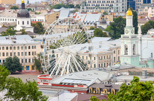 beautiful view of summer Kiev. Roofs of Podol and a view of the left bank