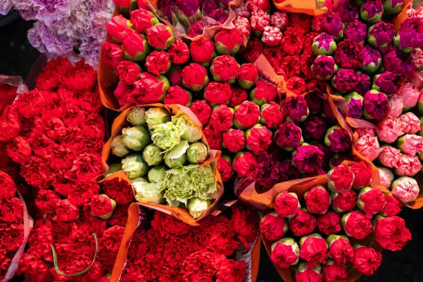 Photo of Colorful and exotic Colombian flowers in the market square