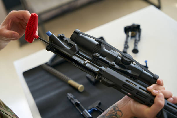 istock Tool for cleaning firearms in male hands 1415070768