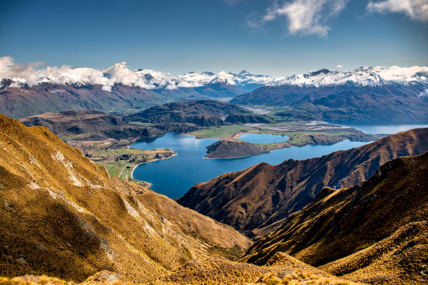 Stunning scenic views of Lake Wanaka and Aspiring national park Roys Peak , Wanaka (in my opinion the best one day walk in NZ…. the views just keeping better)…the view looks out over the Diamond Lake conservation area of Mt Aspiring National Park mount aspiring stock pictures, royalty-free photos & images
