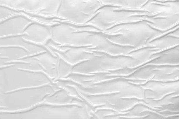 istock white crumpled and creased plastic poster texture background 1415074637
