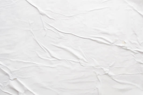 istock white crumpled and creased paper poster texture background 1415074641