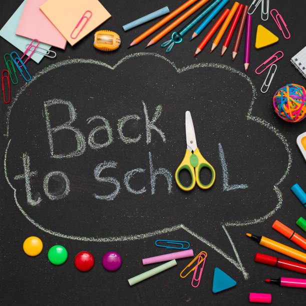 istock School multi-colored supplies, pencils and a drawn cloud with copy space for text. 1415074811