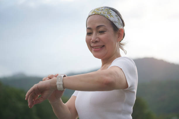 istock Exercise women use smart watch in nature park. 1415077909