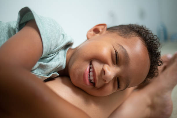 istock Mom and Son hanging out on the Carpet 1415086832