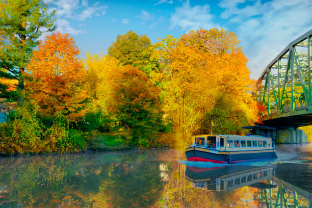 Canal Boat and Bridge over the Erie Canal in fall-Pittsford, New York Cannel Boat and Bridge over the Erie Cannel in fall-Pittsford, New York erie canal stock pictures, royalty-free photos & images