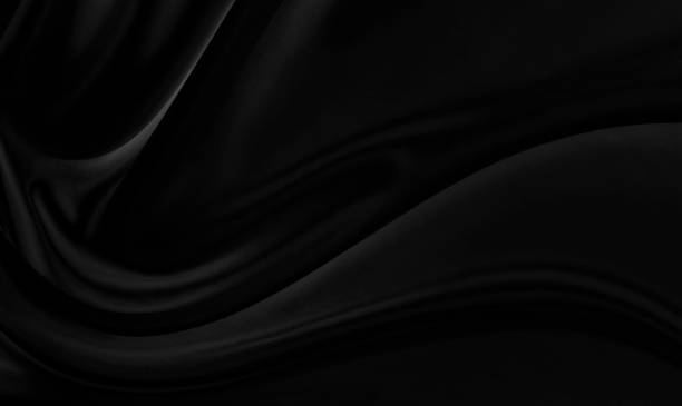 istock Black gray satin dark fabric texture luxurious shiny that is abstract silk cloth background with patterns soft waves blur beautiful. 1415091253