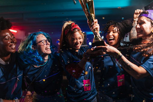 Female gamers celebrating victory on a eSports tournament