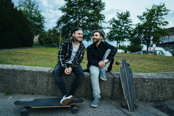 istock Two young men in the  city with longboards 1415092642