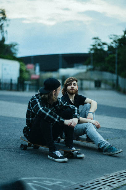 istock Two young men in the  city with longboards 1415092809