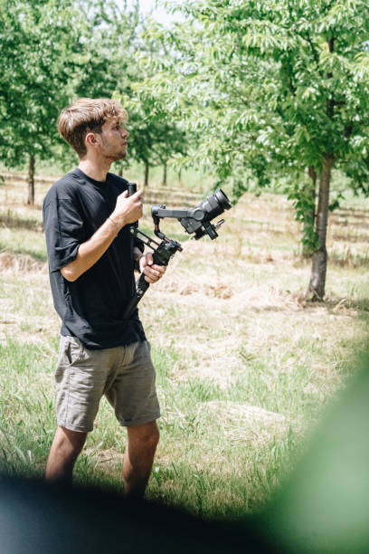 istock Photographer shoots in an orchard 1415093535