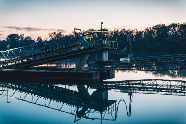 istock Conveyor belt over water at dusk 1415093893