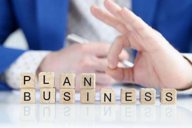 istock Business plan text and businessman hand with ok gesture 1415098462