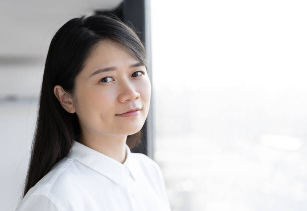 istock Asian woman in white shirt 1415100546