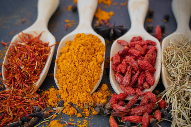 istock plate and spice on dark background. 1415103898