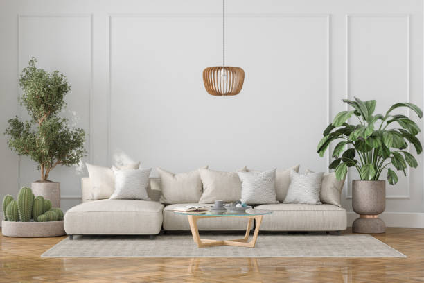 코너 소파, 녹색 식물 및 커피 테이블이있는 현대 거실 인테리어 - cushion sofa pillow indoors 뉴스 사진 이미지